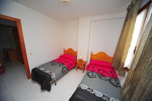 Posteľ alebo postele v izbe v ubytovaní Meridià Orange Costa + 23 fotografií
