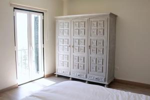 Ένα ή περισσότερα κρεβάτια σε δωμάτιο στο Casa na Aldeia 2ºAndar