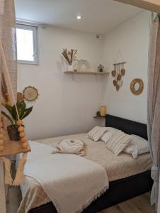 Posteľ alebo postele v izbe v ubytovaní Appartement cosy proche du port