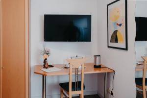 TV a/nebo společenská místnost v ubytování Hotel-Gasthof Zur Krone