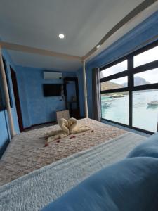 Postel nebo postele na pokoji v ubytování La Salangane Beach Hotel - Downtown
