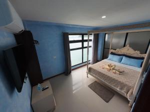 Postel nebo postele na pokoji v ubytování La Salangane Beach Hotel - Downtown