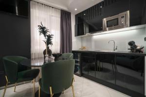 Kuchyň nebo kuchyňský kout v ubytování Apartments Antonia