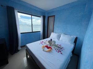 Ένα ή περισσότερα κρεβάτια σε δωμάτιο στο La Salangane Beach Hotel - Downtown