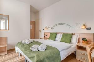 Posteľ alebo postele v izbe v ubytovaní Albergo Alla Costa