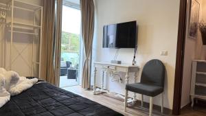 TV a/nebo společenská místnost v ubytování Ohana Florence Suite