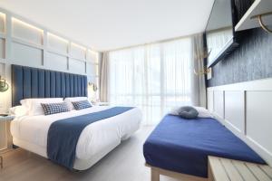 Postel nebo postele na pokoji v ubytování Hotel Luze El Villa + 37 fotografií