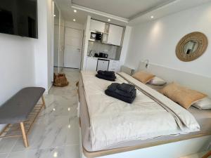 a bedroom with a large bed with two bags on it at Tenerife Sea View Sun Beach Apartment 220 in Playa Fañabe +57 photos