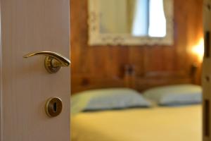Łóżko lub łóżka w pokoju w obiekcie Residence Au Vieux Grenier