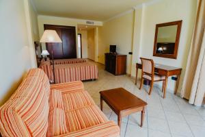 Postel nebo postele na pokoji v ubytování Hotel Hacienda Don Manuel