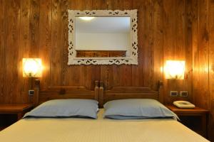 Łóżko lub łóżka w pokoju w obiekcie Residence Au Vieux Grenier