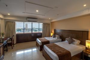 Postel nebo postele na pokoji v ubytování Ivory Tower + 14 fotografií