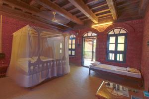 Konkan Nest Resort客房内的一张或多张床位