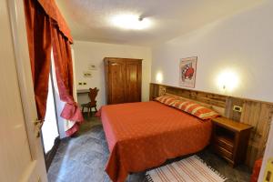 Łóżko lub łóżka w pokoju w obiekcie Residence Au Vieux Grenier