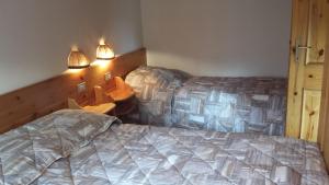 Posteľ alebo postele v izbe v ubytovaní Supermountainski Colfosco