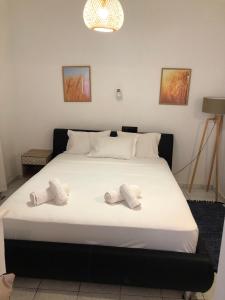 Ein Bett oder Betten in einem Zimmer der Unterkunft Xastero