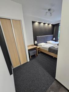 Posteľ alebo postele v izbe v ubytovaní Apartamenty N 25 Przy Kaponierze
