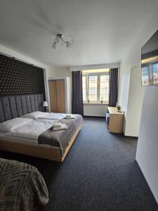 Posteľ alebo postele v izbe v ubytovaní Apartamenty N 25 Przy Kaponierze