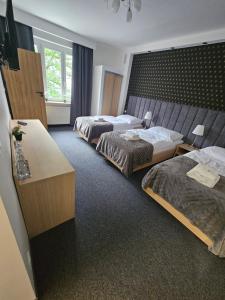 Posteľ alebo postele v izbe v ubytovaní Apartamenty N 25 Przy Kaponierze