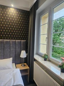 Posteľ alebo postele v izbe v ubytovaní Apartamenty N 25 Przy Kaponierze