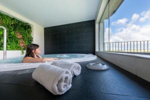 Uma cama ou camas num quarto em Nemea Appart Hotel Concorde Toulouse Gare Matabiau