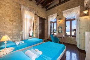 A bed or beds in a room at Dotira
