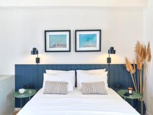 Voodi või voodid majutusasutuse Magoo Suites toas