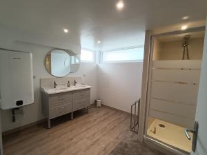 a bathroom with a sink and a mirror at La C-onciergerie in Camblain-lʼAbbé +31 photos