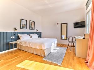 Voodi või voodid majutusasutuse Magoo Suites toas