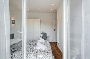 a small bedroom with a bed and a mirror at Centrally located apartments, free parking in Trogir +90 photos