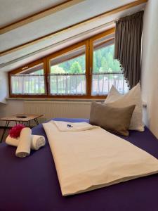 En eller flere senge i et værelse på Ferienwohnung Vesna & Alex