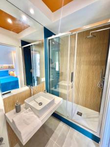 a bathroom with a sink and a shower at Mongibello Rooftop in Mondello