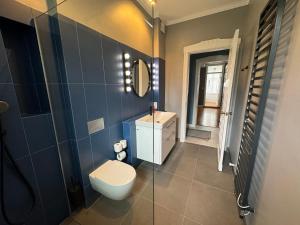 Kúpeľňa v ubytovaní Victus Apartamenty, Apartament Grand + 11 fotografií