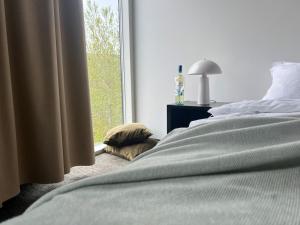 Postel nebo postele na pokoji v ubytování Hótel Bifröst