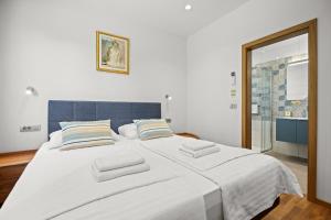 Ein Bett oder Betten in einem Zimmer der Unterkunft Villa Monte Uliveto