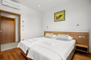 Ein Bett oder Betten in einem Zimmer der Unterkunft Villa Monte Uliveto