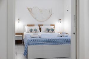 Ένα ή περισσότερα κρεβάτια σε δωμάτιο στο Casa Marianna Apartments