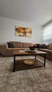 a living room with a couch and a coffee table at Superb 1 bedroom in the best zone of the city. in Ferizaj