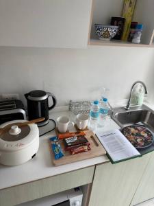 a kitchen counter top with a sink and a counter top at 350 METER BEACH, Newly renovated Condo in Hua Hin