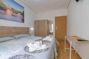 Postel nebo postele na pokoji v ubytování CINCO VILLAS