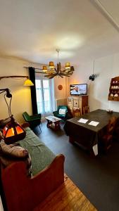 a living room with a bed and a dining room at Les Montagnettes in Le Mont-Dore +58 photos