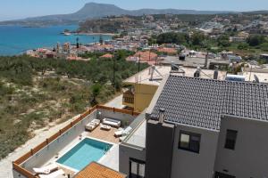 an aerial view of a house with a swimming pool at Tersus Luxury Villa in Kalyves