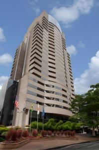 a tall building with flags in front of it at Cyclinn Berrini in Sao Paulo +8 photos
