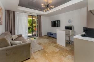 a living room with a couch and a table at Astria Eclipse - Complex Novum in Olimp