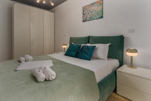 a bedroom with two beds with towels on them at Astria Eclipse - Complex Novum in Olimp