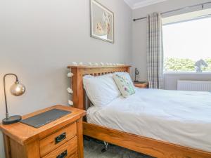 En eller flere senge i et værelse på Maryland Cottage