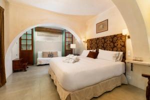 Łóżko lub łóżka w pokoju w obiekcie Hotel Boutique V