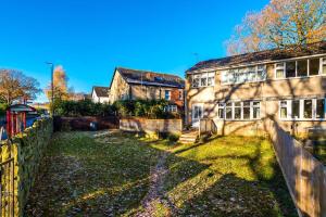 an old house with a fence in front of it at BIG 7xGuest House 3xVan Locked CarPort Garden Leeds & Bradford in Leeds