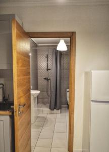 a bathroom with a shower and a toilet at Pine forest house 5 in Gauja +34 photos