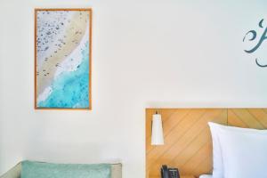 Postel nebo postele na pokoji v ubytování Marassi Boutique Hotel-Blanca + 1 fotografie